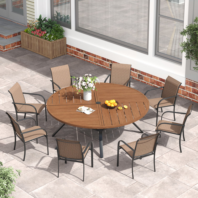 Round Patio Dining Set with 60" Metal Dining Table and 8 Stackable Armrest Textilene Chairs