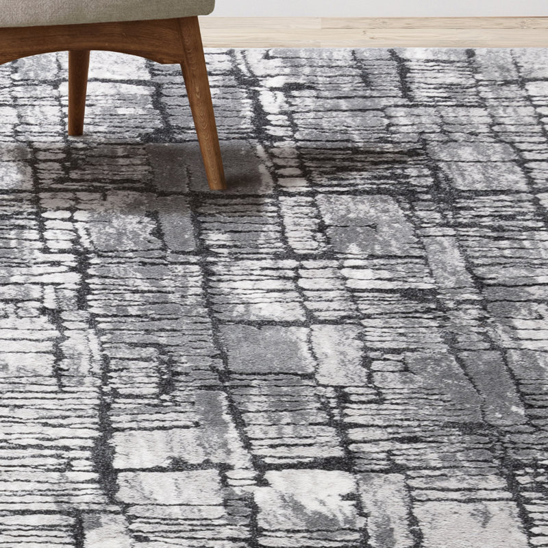Imani 6' x 9' Black and Gray Abstract Shag Rug