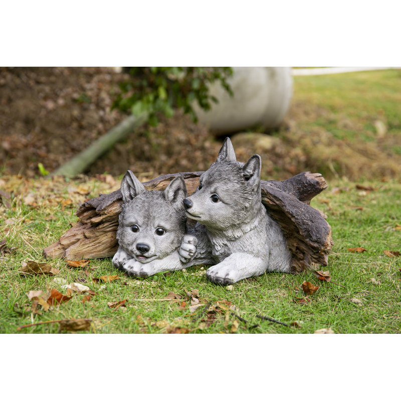 Grey Wolf Cubs Hiding Under Log Statue