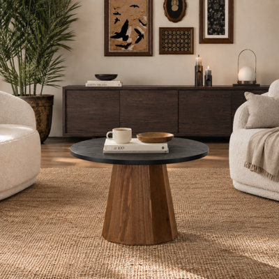 Table basse ronde de 60 cm (23,6 pouces) avec plateau imitation bois, pied central fuselé, structure en MDF et montage facile, idéale pour le salon, les petits espaces et les appartements.