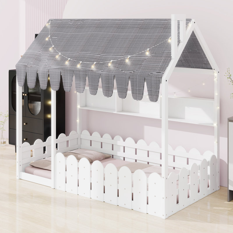 Lit de plancher pour enfant équipé d'une clôture de sécurité, d'une tente de jeu, de lumières décoratives et de compartiments de rangement