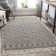 Tapis noir / blanc en laine tissé à plat à la main à motif géométrique Carletta
