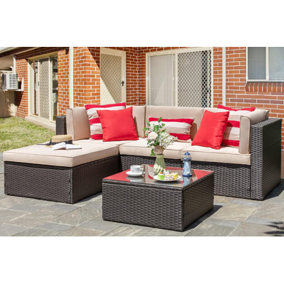 Ensemble de conversation modulaire en rotin 5 pièces avec canapé, coussins, coussins et table en verre