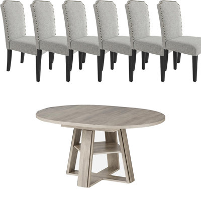 Ensemble de table et de chaises de salle à manger extensibles, rondes à ovales, avec tablette de rangement et chaises rembourrées.