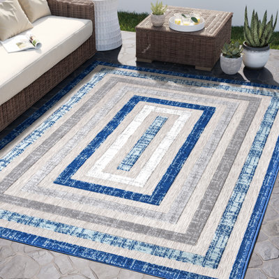 Tapis géométrique bleu / gris en polypropylène Gibson