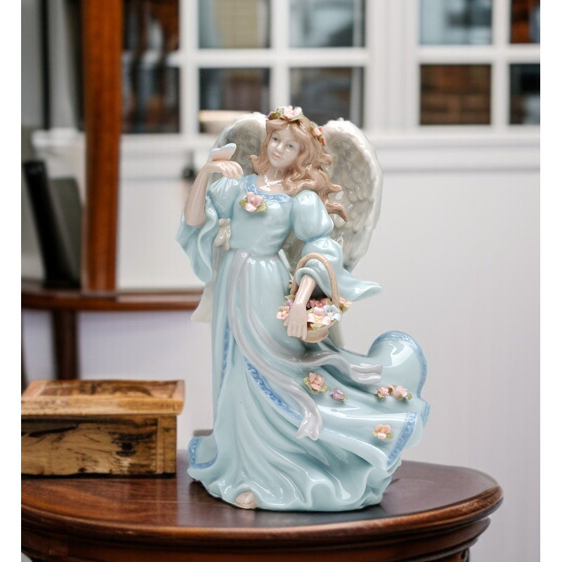 Figurine musicale ange avec panier de fleurs et papillon