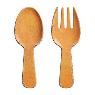 Orange plastic spoon-shaped salad tosser from a picnic set