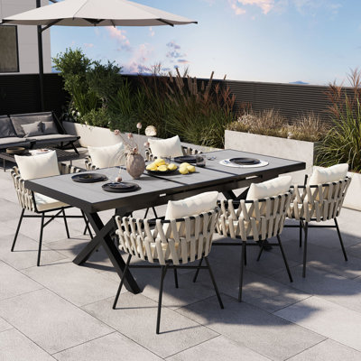 Discover Unmatched Flexibility In Alfresco Dining With Six Creatively Arranged Chairs Made Of Polyester Woven Tape And A Table