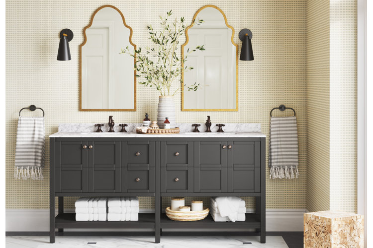 Double sink vanity with two arched shaped mirrors with gold antique-looking frames.