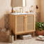 Meuble-lavabo de salle de bain avec lavabo en céramique et portes en rotin