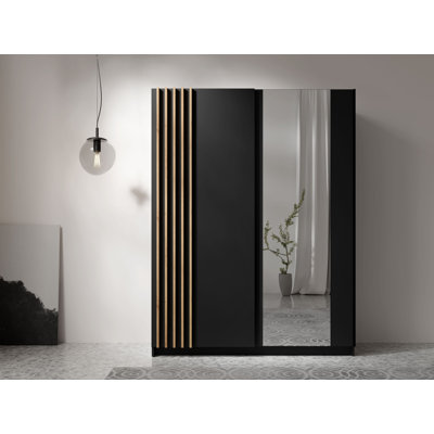 This two -door sliding wardrobe is made of black laminate with Aristan oak. It measures 150/198.5/63.5cm high