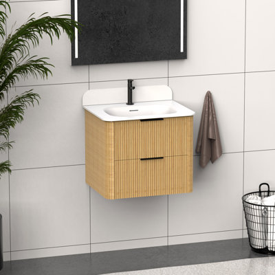 Meuble-lavabo de 24 po en bois massif avec lavabo en acrylique intégré, panneau cannelé et rangement fonctionnel.
