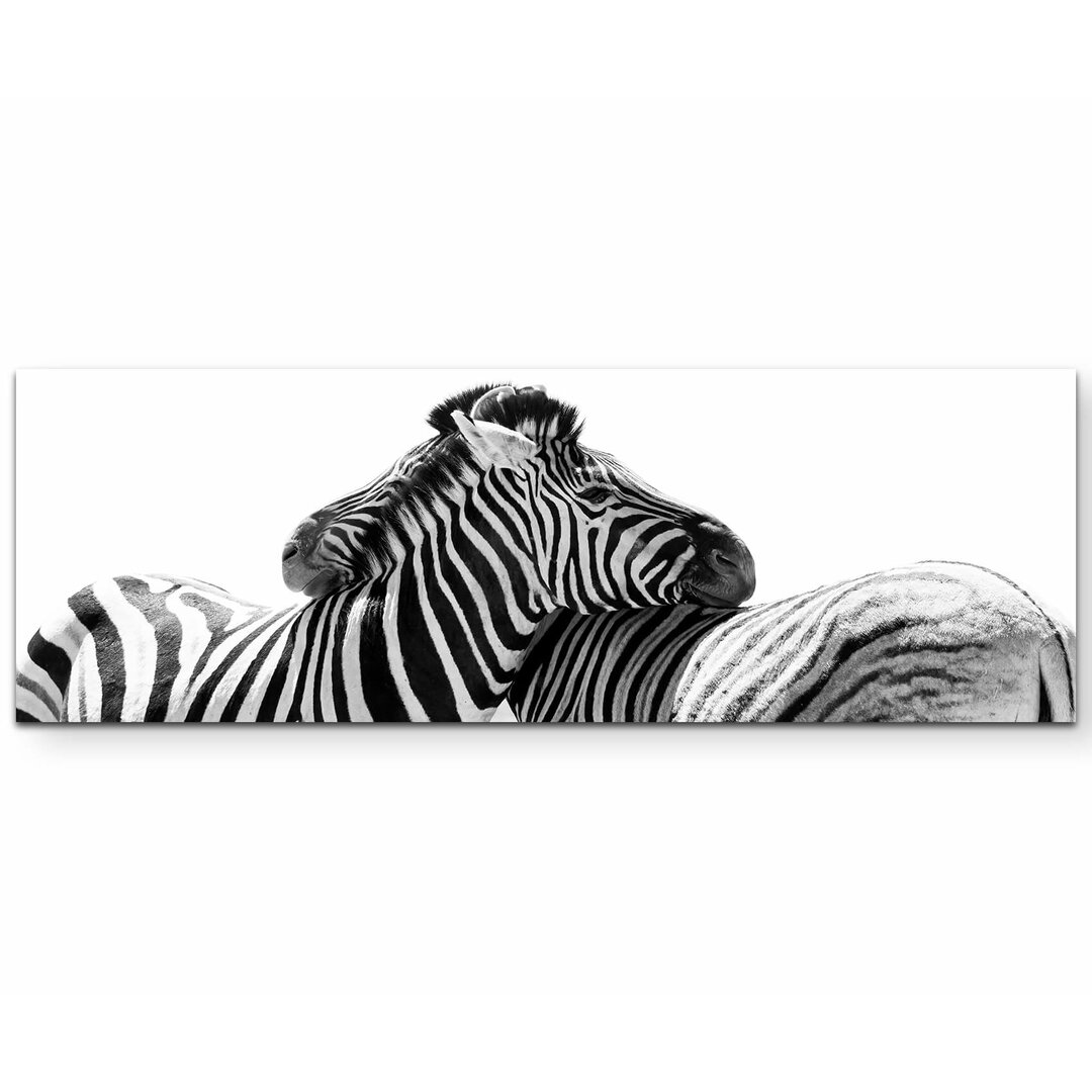 Leinwandbild Kuschelnde Zebras – Namibia