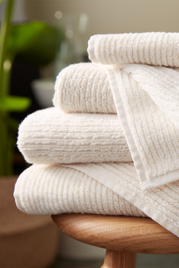 Premium Photo  Collection of natural muslin kitchen towels stacked neatly  in a vertical stack