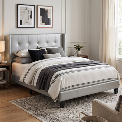 Arshaun Upholstered Faux Leather Wingback Bed