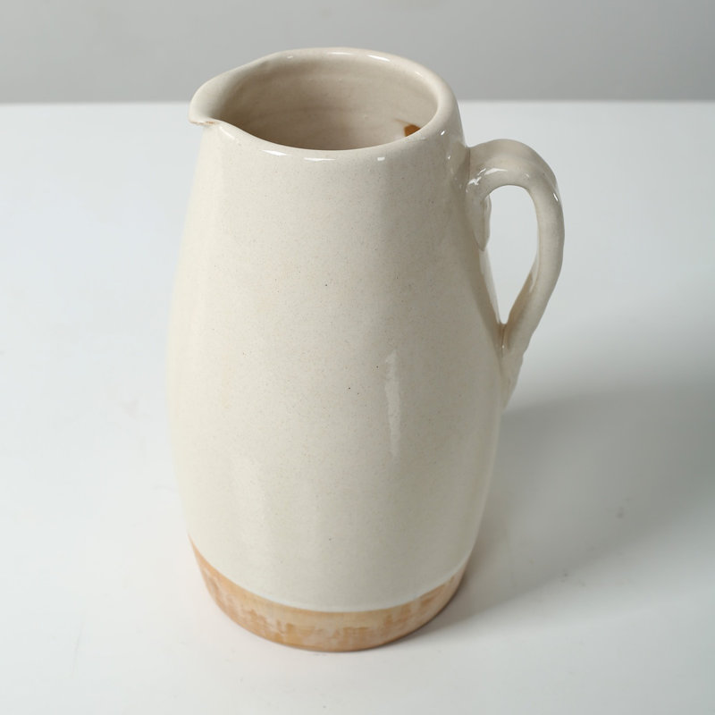 Approx. 9" High Off Whtie Ceramic Pitcher