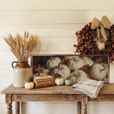 White Pumpkin Cluster In Autumn Leaves