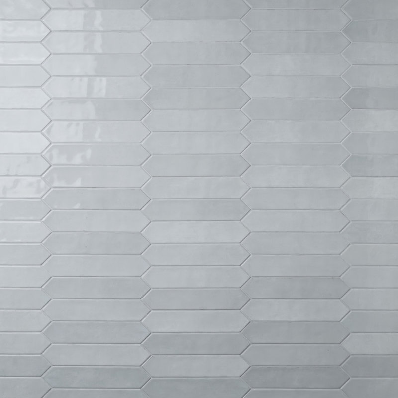 Light gray ceramic picket wall tile with a glossy finish in a stacked pattern.