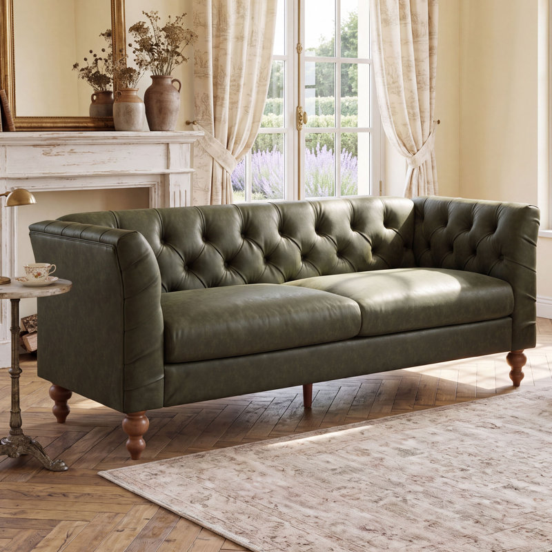 Canapé Chesterfield traditionnel Ivarn de 187 cm de large, recouvert de PU, avec dossier capitonné en losanges, accoudoirs évasés et pieds en bois d'hévéa