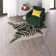 Lilianna Handmade Tufted Faux Cowhide Black Area Rug