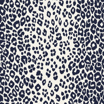 Wallpaper in a dark navy and cream leopard print pattern
