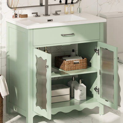 Meuble-lavabo de 79 cm avec lavabo rectangulaire en céramique, grand espace de rangement, rayures verticales et pieds en bois d'hévéa pour une installation stable et confortable. Portes en verre rayé, faux tiroir, pentures à fermeture douce.