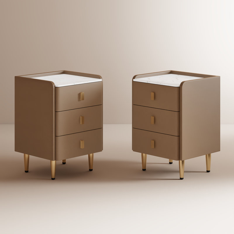 Annie Set of Nightstand with solid wood core, faux leather upholstery and engineered marble top, featuring 3 drawers and raised non-slip edges.