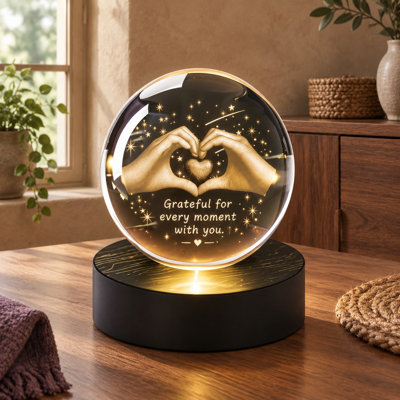 This engraved 2.36-Inch glass orb night lamp depicts 3D heart-and-hand imagery and serves as a gratitude gift for moms, wives, women, boyfriends, or girlfriends, including anniversaries and Mother's Day.