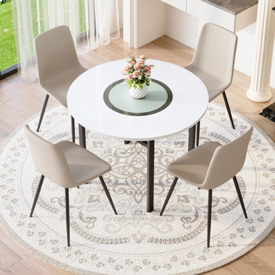 Modern Minimalist Desktop Round Dining Table With 4 Chairs And Curved Widened Cushion Design For Dining Gatherings