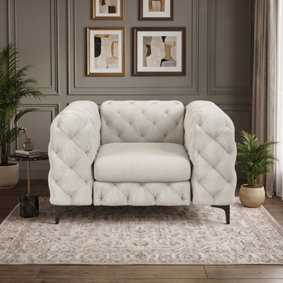 Fauteuil Chesterfield capitonné et rembourré en polyester