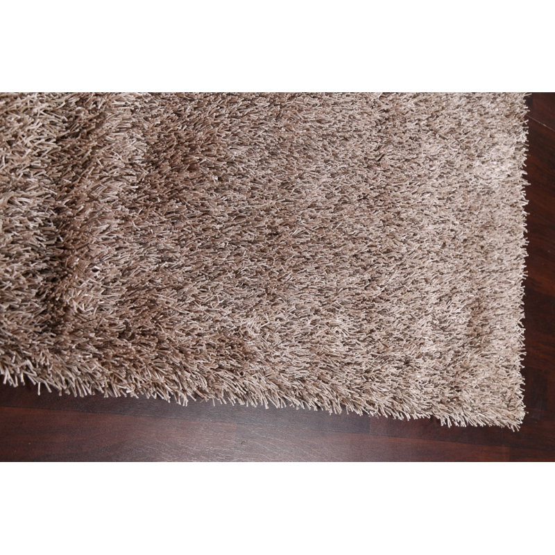 Tapis beige touffeté à la main