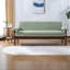 Canapé moderne moderne avec causeuse verte, revêtement en polyester, style compact pour les espaces confortables