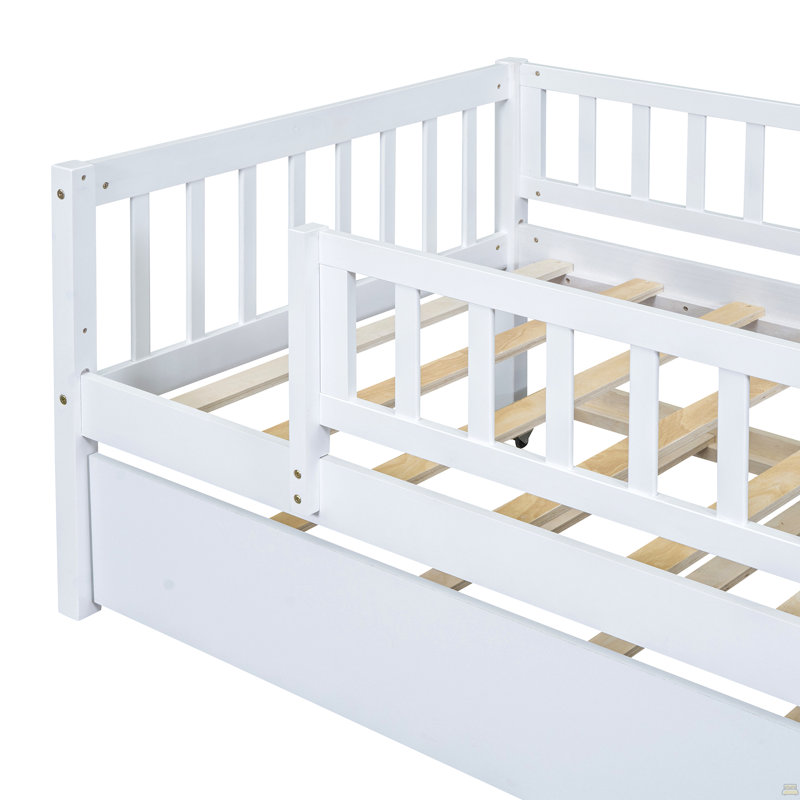 Lit de jour simple en bois avec lit gigogne et barrière de sécurité, blanc