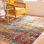 Tapis abstrait bleu sarcelle / orange Harrill