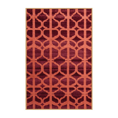 Tapis rose à motif treillis lavable à la machine