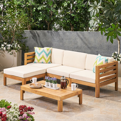 Meuble en bois beige avec coussins pour chaises de patio