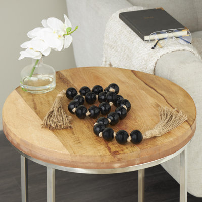 Guirlande perlée noire en verre avec pampille et jute noué à la main
