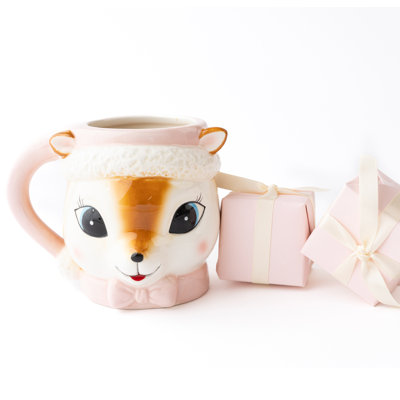 Tasse à café rose avec renne