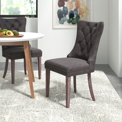 Alexes Tufted Leather Upholstered Wing Back Dining Chair Featuring Water & Stain Resistance