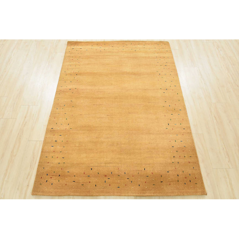Tapis oriental doré en laine noué à la main
