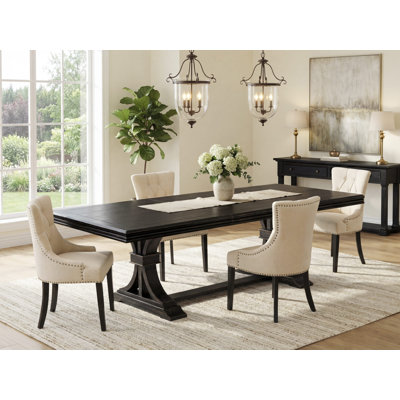 L'ensemble de salle à manger 5 pièces comprend une table de cuisine et 4 chaises de cuisine en tissu de lin beige clair et des pieds noirs avec dossier capitonné - finition noir sablé.