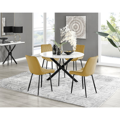 Tierra Sleek Black Metal and White Gloss Round Dining Table Set with 4 Luxury Velvet Dining Chairs
