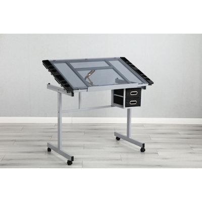Bureau de dessin réglable avec 2 tiroirs en tissu et 4 roulettes, table de 0 à 70 degrés, surface en verre transparent, structure en acier thermolaqué, rebord à crayons coulissant de 24 po, gris argenté, 24,05 po
