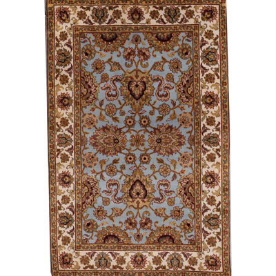 Tapis bleu et ivoire de haute qualité noué à la main