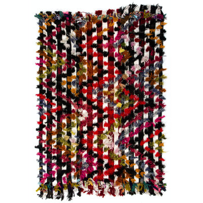 Tapis turc rétro avec des pompons colorés, idéal pour la chambre d'enfant