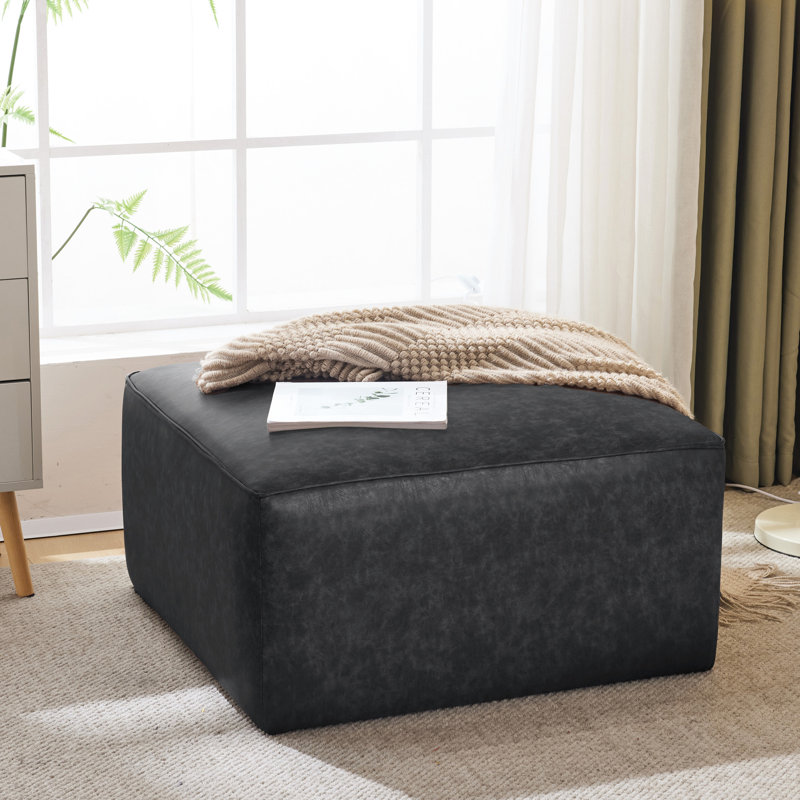Salon carré en similicuir noir - et design élégant, fonctionnel et minimaliste