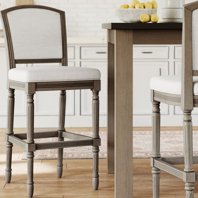 Tabouret de bar de 31 po de hauteur avec revêtement texturé gris, pieds tournés pour l'espace de jeu avec siège et dossier rembourrés gris
