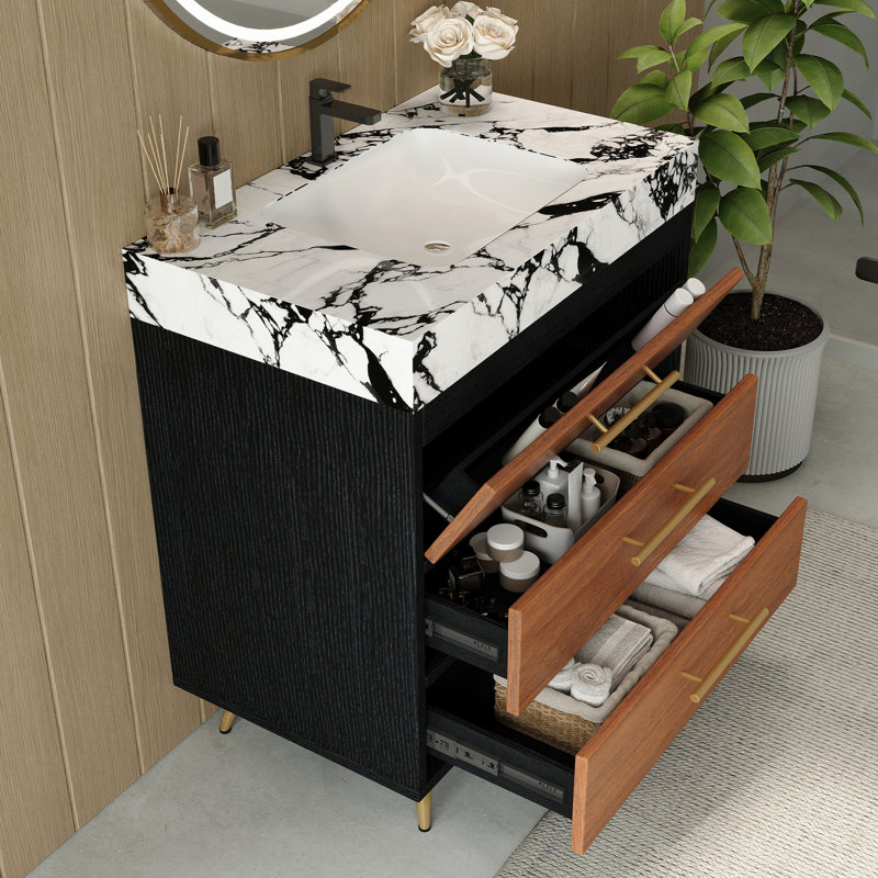 Meuble-lavabo de style milieu du siècle avec lavabo en céramique, comptoir en pierre frittée et structure stable en acier. Pieds de salle de bain en acier inoxydable, rangements pratiques.