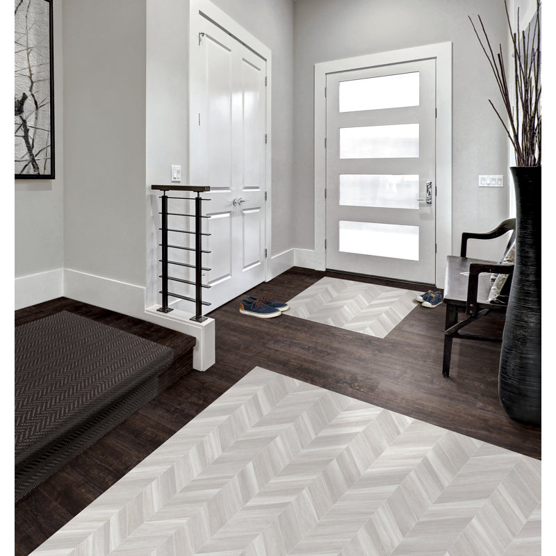 Tapis gris / blanc à chevrons