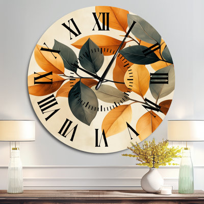Horloge murale moderne en métal avec motif de feuilles botaniques aux tons naturels